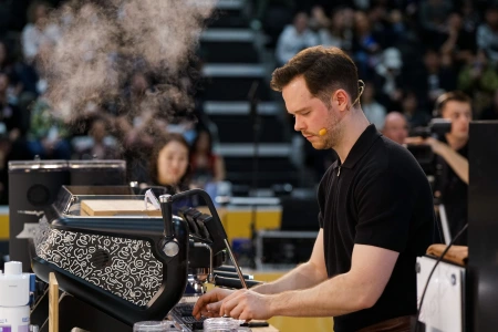 Australia's Anthony Douglas competing in the finals of the 2022 World Barista Championship. Photo: the Specialty Coffee Association